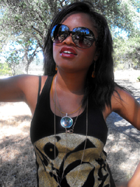 photo of Fashion Designer Kristin Brady of KTG Fashions wearing her CQR amulet