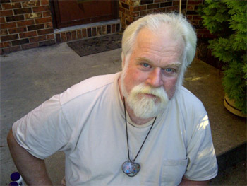 Mark McGibbon showing his array of amulets